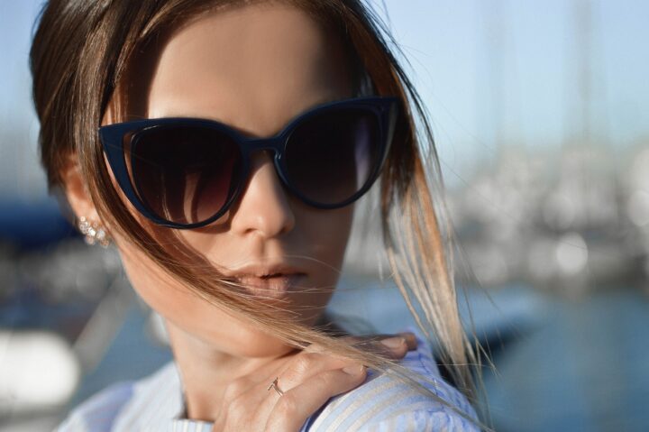 This lovely model seems wistful and yet dramatic in big sunglasses.