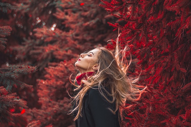 Autumn trees with woman flicking Hair