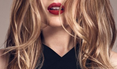 Lower half of woman's face with red lips and blonde hair