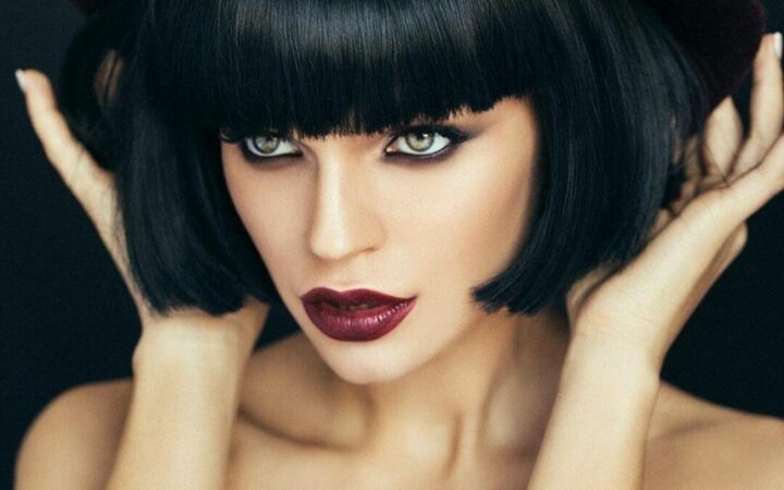 Woman with stunning, short black hair